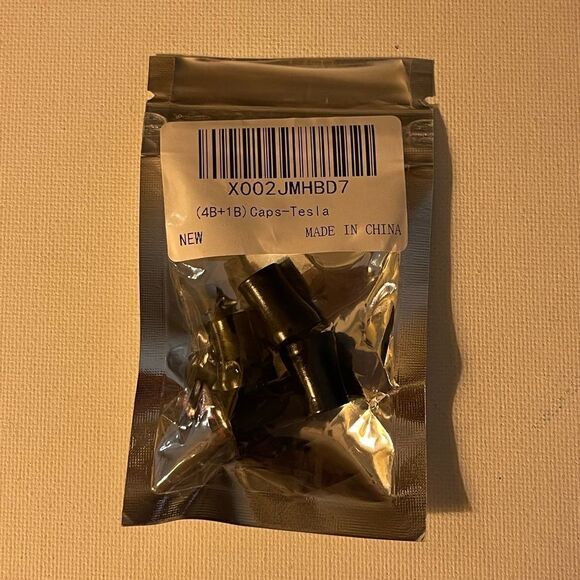 Tesla valve Stem caps in Black set of 4 NWT - Picture 3 of 3